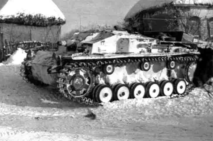 German self-propelled guns StuG III in winter camouflage color