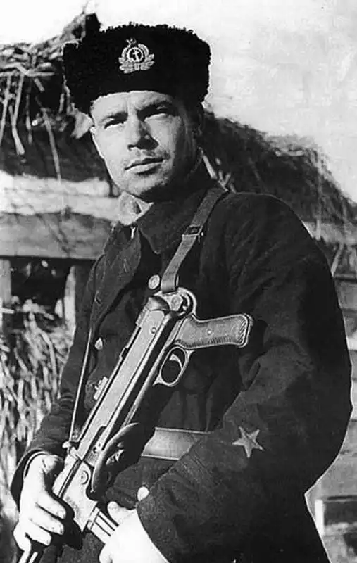 Soviet naval infantryman holding a captured German MP 38/40 submachine gun, 1941