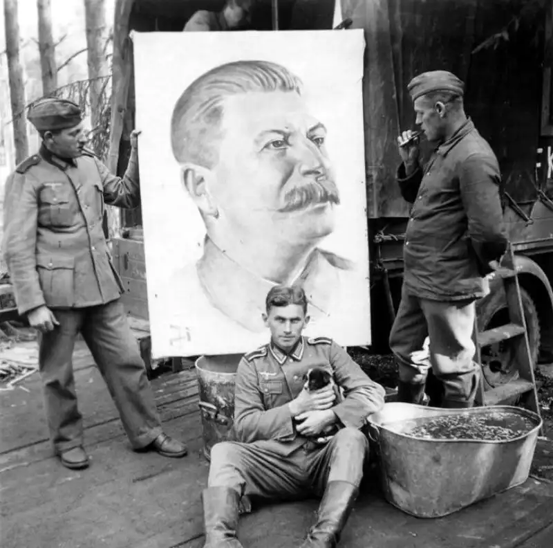 German Soldiers Pose with Captured Portrait of Joseph Stalin, Summer 1941