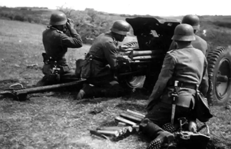 German crew operating a 37mm PaK 35/36 anti-tank gun waiting for Soviet tanks during summer 1941 on the Eastern Front