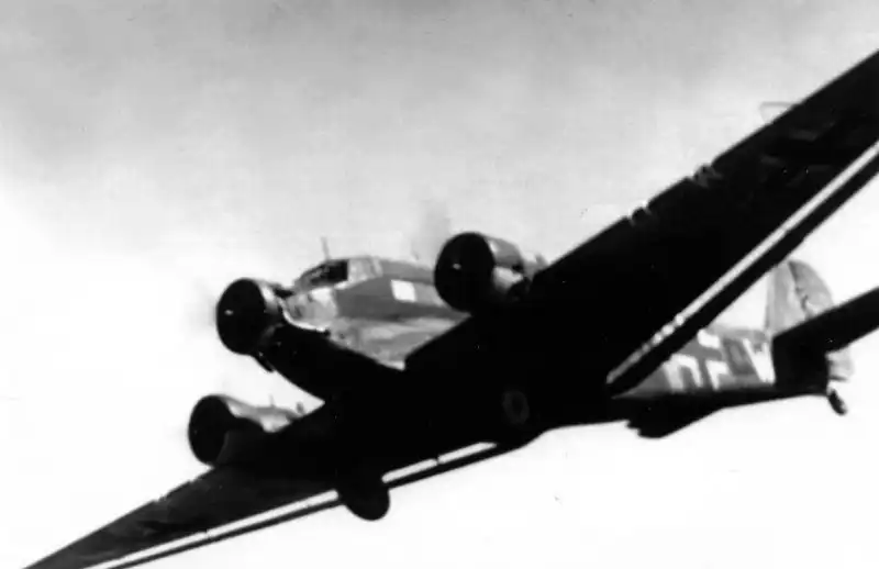 German Junkers Ju 52 transport aircraft flying over Germany in 1937, a tri-engine plane later widely used by the Luftwaffe