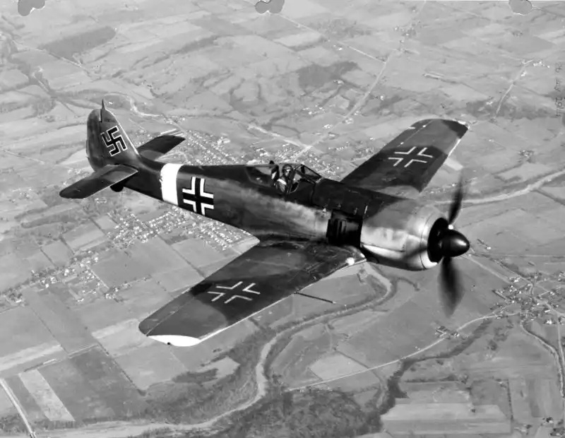 German Luftwaffe fighter Focke-Wulf Fw 190 flies above Europe, May 1944.