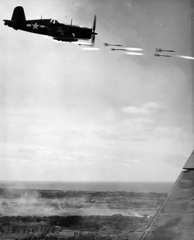 American F4U Corsair launching HVAR rockets against Japanese ground targets during the Battle of Okinawa, June 1945.