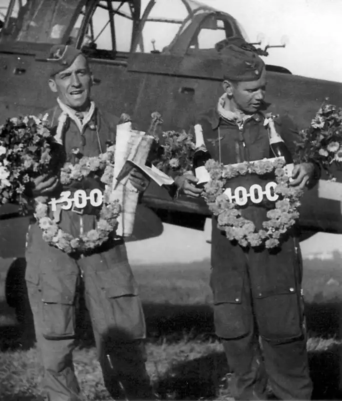 Luftwaffe Stuka pilot Hans-Ulrich Rudel and gunner Emil Oechsler holding commemorative wreaths for 1300 and 1000 combat sorties August 1943.