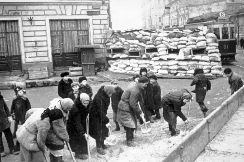 Civilian volunteers constructing street defenses in Moscow during the German advance on the capital in the Battle of Moscow.