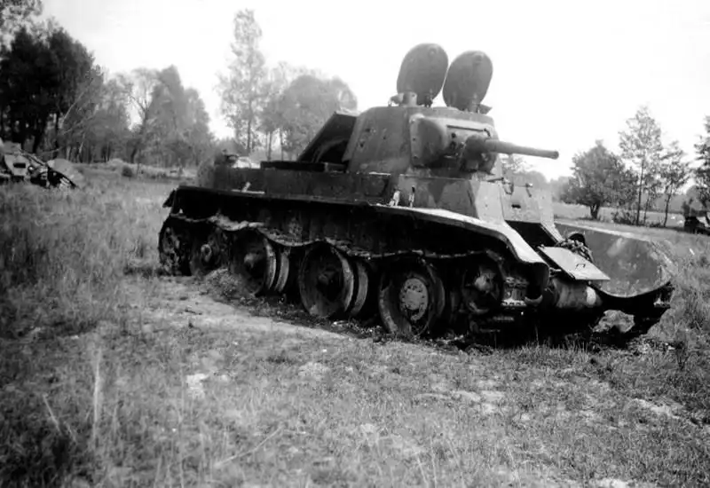 Burnt Soviet BT-7 light tank, destroyed on the Eastern Front, 1941, symbolizing the early Soviet losses during the Nazi invasion.