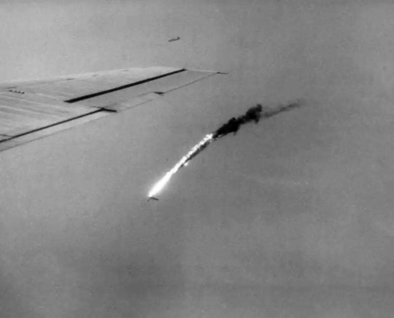 American B-29 Superfortress bomber trailing heavy fire and smoke after being shot down over the Pacific Ocean 1945.