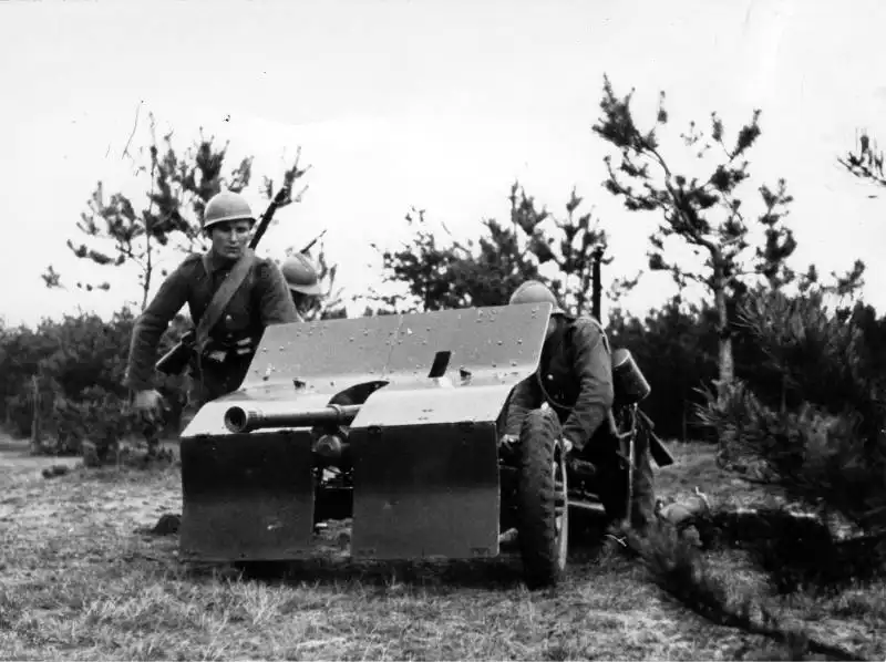 Polish soldiers operating a 37 mm Bofors wz.36 anti-tank gun during military exercises in Poland, 1939.