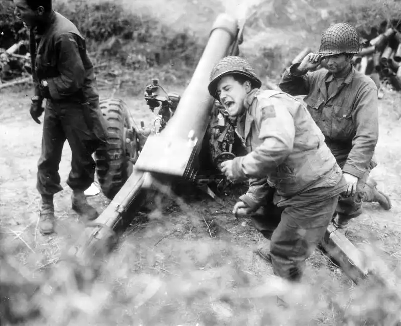 U.S. M3 105mm Howitzer Firing on German Forces at Carentan, July 1944
