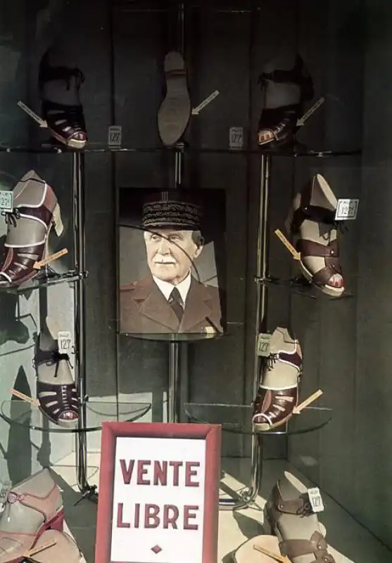 Shop window with portrait of Marshal Pétain in occupied Paris, 1942 color WWII photograph