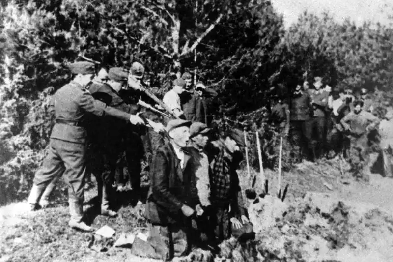 Archival photo of Einsatzgruppe A firing squad executing civilians in Kaunas Lithuania, submitted as evidence at the Nuremberg Trials.