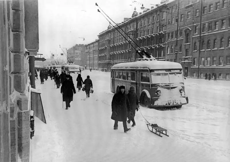Abandoned YaTB-1 trolleybuses standing on snow-covered Nevsky Prospect after electricity failure during the Siege of Leningrad