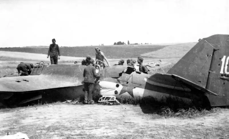 German soldiers examining the wreckage of a shot-down Soviet SB bomber on the Eastern Front in 1941.