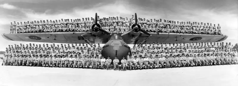 Royal New Zealand Air Force No. 6 Squadron personnel posing on the wings and fuselage of a PBY-5 Catalina flying boat 1944.