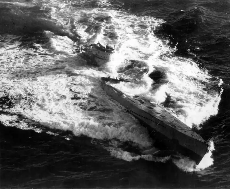 German submarine U-185 sinking in the Atlantic Ocean after an American TBF Avenger and F4F Wildcat attack during World War II