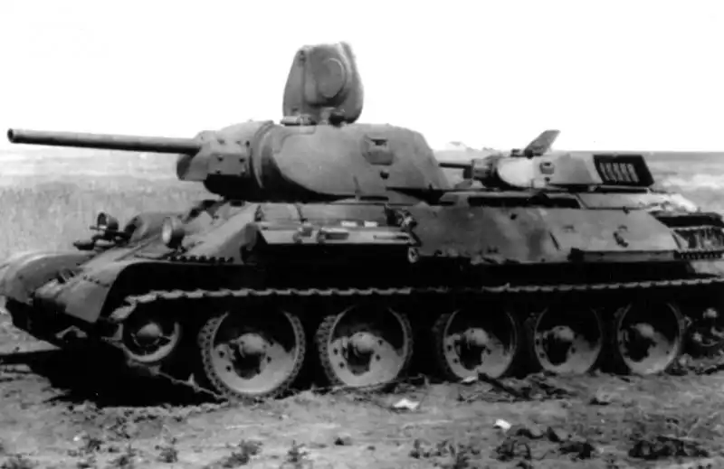 Two abandoned Soviet T-34-76 tanks in the steppe during the Red Army retreat, USSR, summer 1941
