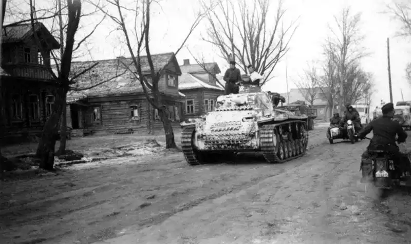 German Command Tank Pz.Bf.Wg. III Ausf. H Moving Through a Village in the USSR, Spring 1942