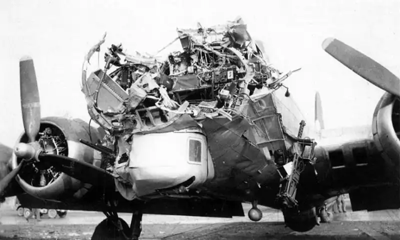 Head-on front view of destroyed nose section and cockpit wiring on damaged B-17G Flying Fortress 43-38172.