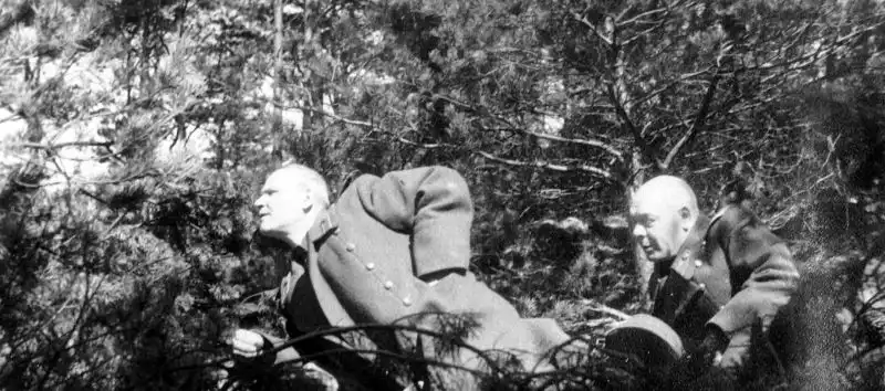 Marshal Ivan Konev and Colonel General Dmitry Lelyushenko observe the frontlines from a pine tree during the Neisse offensive