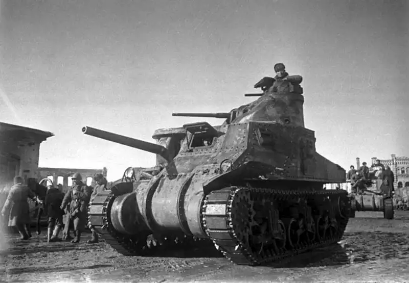 Soviet troops ride on American M3 "General Lee" tanks during the liberation of Vyazma