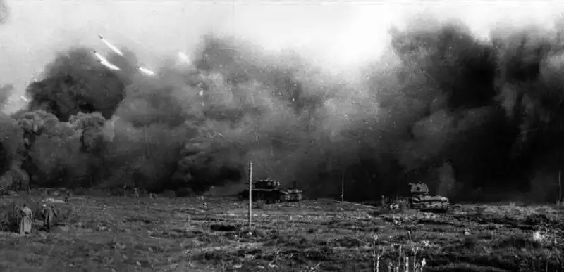Massive salvo of M-30 heavy rockets and advancing Soviet KV-1 tanks during the offensive in Karelia, 1944.