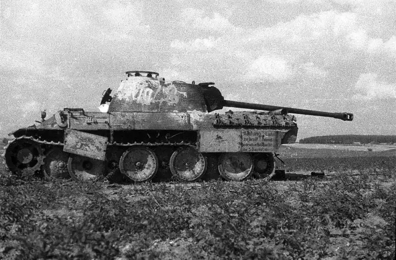 A knocked-out Panther Ausf. A tank destroyed during Operation Bagration. A German transport warning placard remains legible on the hull