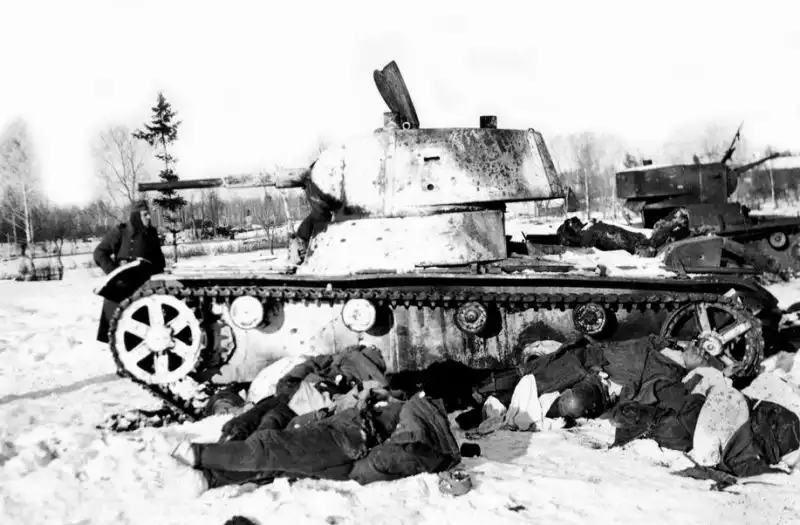 Destroyed Soviet T-26 light tanks and fallen Red Army infantrymen after a German ambush during the Battle of Moscow, winter 1941