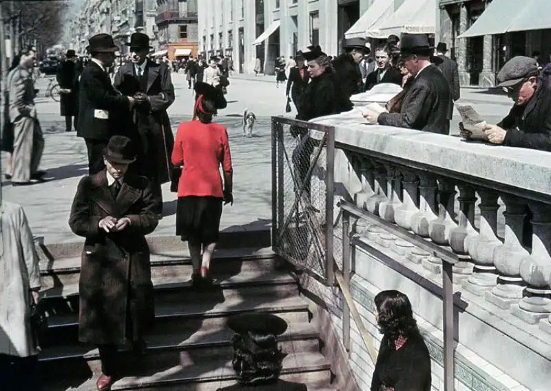 Civilians walking along the streets of occupied Paris, 1942 color photograph