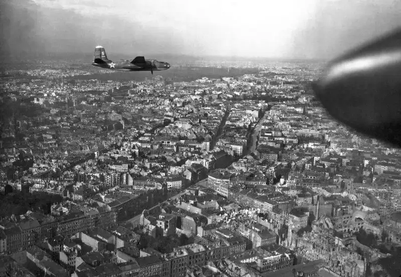 Soviet Navy Douglas A-20G Boston torpedo bomber No. 5 flying over the ruined cityscape of Berlin in May 1945.