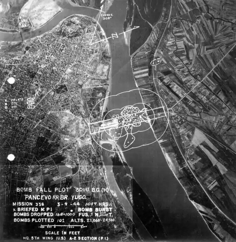USAAF official bomb fall plot map showing impact coordinates and 102 plotted bomb bursts on the Prince Peter II railroad bridge Belgrade 1944.