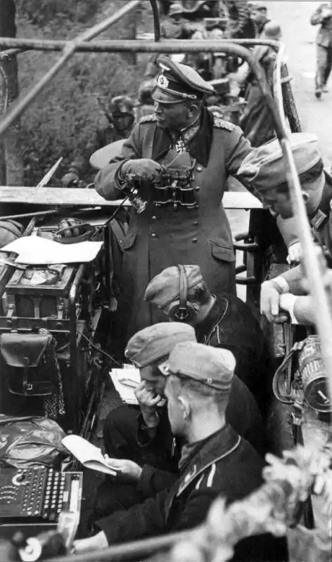 General Heinz Guderian inside Sd.Kfz. 251/3 command half-track with Enigma enciphering machine and radio operators in France May 1940.