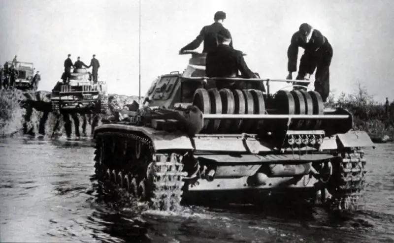 German Panzer III tanks crossing a river on the Eastern Front during Operation Barbarossa in the summer of 1941.