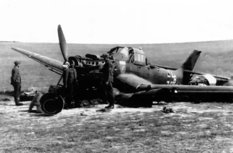 German Junkers Ju 87 dive bomber damaged during takeoff and inspected by Luftwaffe ground crew.