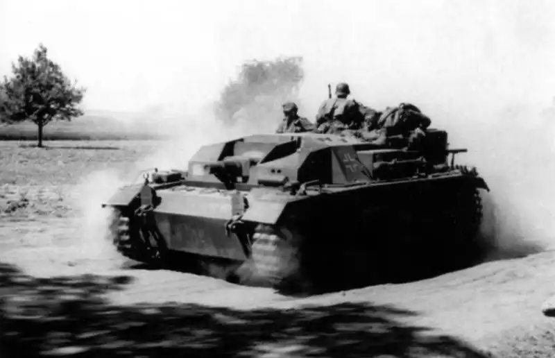 German StuG III Ausf. B assault gun moving along a dusty road on the Eastern Front, USSR, summer 1942