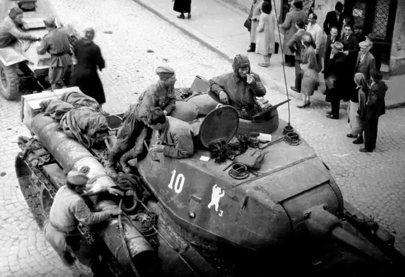  T-34-85 tank number 10 of the 36th Guards Tank Brigade in liberated Belgrade. A BA-64 armored car is visible in the background