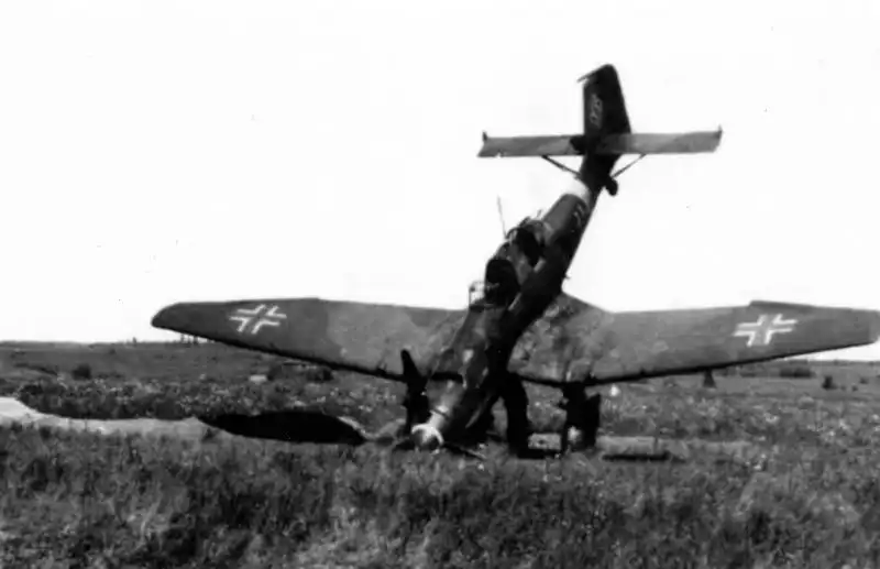 Crashed German Junkers Ju 87 Stuka dive bomber after a forced landing on soft waterlogged ground during World War II