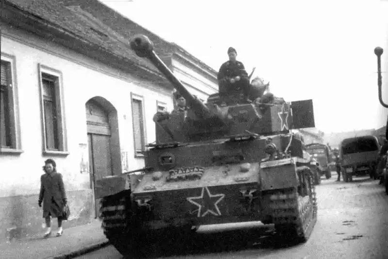 WWII photo showing the Bulgarian 1st Army tank crew posing on a German PzKpfw IV medium tank near the Drava River, Hungary, March 1945.