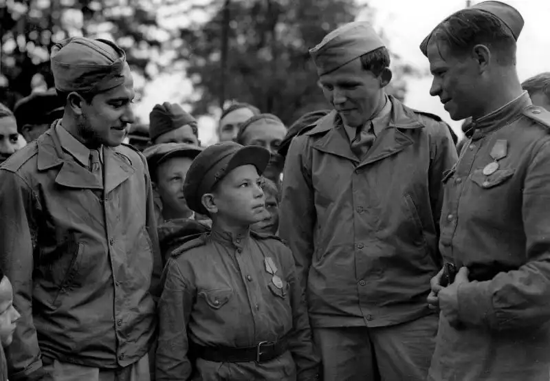 Russian Child Soldier “Son of the Regiment” with US Servicemen at Poltava Airfield, June 1944