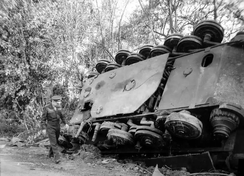 General Eisenhower standing near a destroyed Tiger II tank near Chambois, France, August 1944
