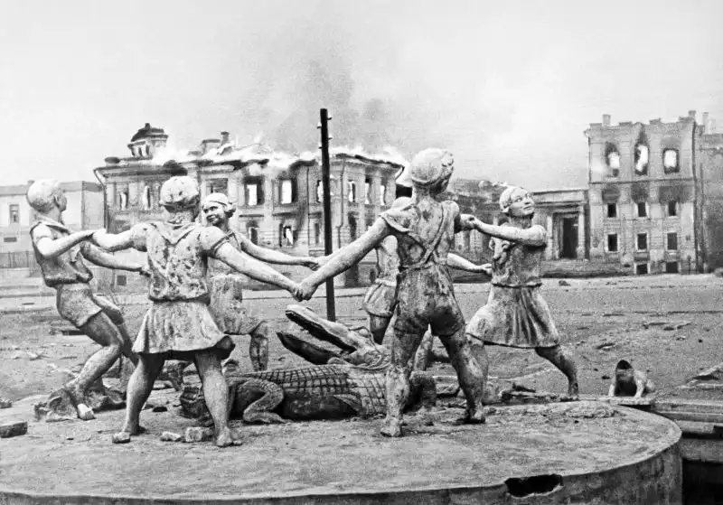 Famous Barmaley Fountain Childrens Khorovod standing intact in front of destroyed Stalingrad Railway Station after Luftwaffe bombing August 1942.