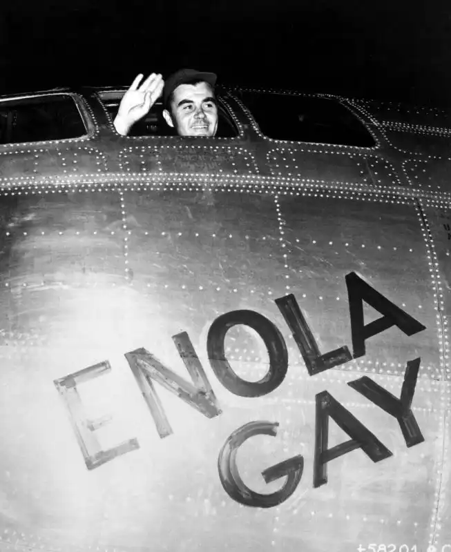 Paul Tibbets waving from the cockpit of the B-29 Enola Gay before the atomic bombing of Hiroshima, August 6, 1945