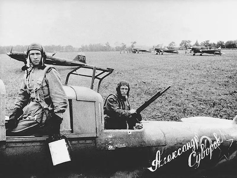 Soviet Il-2 Sturmovik ground attack aircraft named Aleksandr Suvorov with pilot Vasily Aleksukhin and rear gunner Aleksey Gamayunov in August 1943.