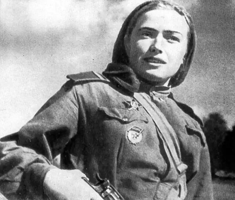 Soviet female medic junior sergeant with Nagant revolver and Red Star medal, World War II
