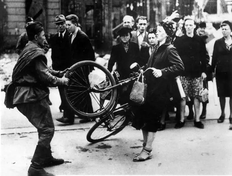 Soviet soldier and Berlin civilian arguing over a bicycle, Berlin, August 1945