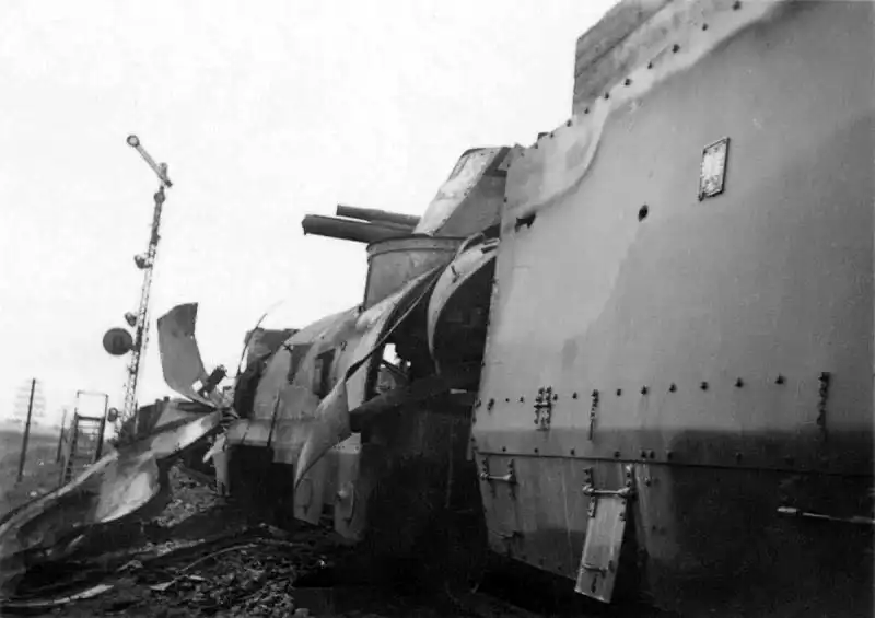 Close-up view of the blown-apart armored plating and gun turret of Polish Armored Train No. 12 Poznańczyk, destroyed alongside railroad tracks in September 1939.