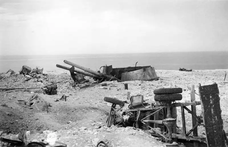 Destroyed 305mm twin gun turret No. 1 of Soviet 35th Coastal Battery and overturned GAZ-AA truck at Cape Khersones Sevastopol July 1942
