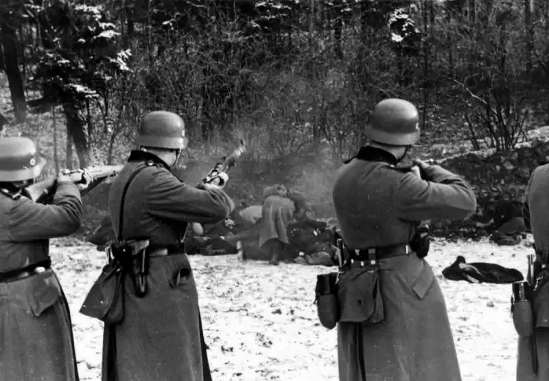 German occupation authorities carrying out the mass execution of 56 Polish civilians in the Uzbornia Forest near Bochnia, Poland, on 18 December 1939 during the early German occupation of World War II