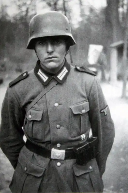 Enlisted private of the SS Police Division wearing M35 helmet, Police collar litzen, and SS sleeve eagle 1942.