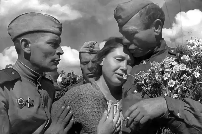 Russian woman reunites with her husband, a Soviet soldier, at the Moscow railway station in June 1945, after his return from the victory in Berlin.