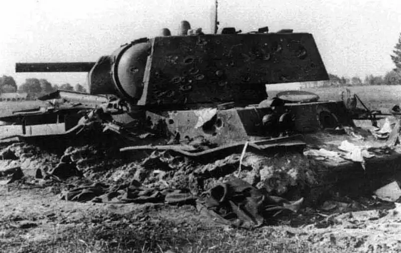 Disabled Soviet KV-1 heavy tank with dozens of shell hit marks on its turret armor and fatal 88mm Flak penetration holes in summer 1941.